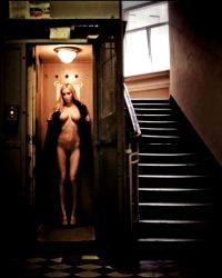 blonde exhibitionist woman in elevator